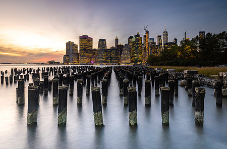 simsearch:6119-09214207,k - Long exposure of the lights of Lower Manhattan during sunset as seen from Brooklyn Bridge Park, New York, United States of America, North America Stock Photo - Premium Royalty-Free, Code: 6119-09253291