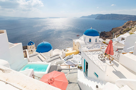 View of blue domed churches from cafe in Oia village, Santorini, Cyclades, Aegean Islands, Greek Islands, Greece, Europe Stock Photo - Premium Royalty-Free, Code: 6119-09253457