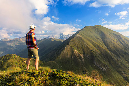 simsearch:6119-08703758,k - Man on top of Monte Rolla looks to Monte Disgrazia and Sasso Canale, Sondrio province, Valtellina, Lombardy, Italy, Europe Stock Photo - Premium Royalty-Free, Code: 6119-09203020