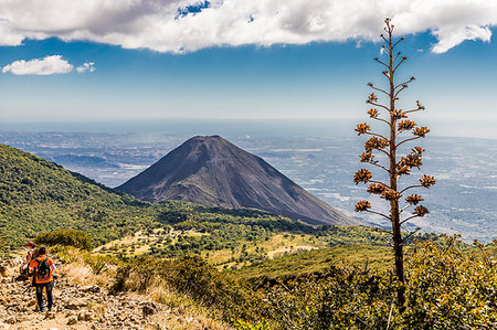 santa ana - A view of Volcano Izalco and a hiker from Volcano Santa Ana (Ilamatepec ) in Santa Ana, El Salvador, Central America Stock Photo - Premium Royalty-Free, Code: 6119-09214219