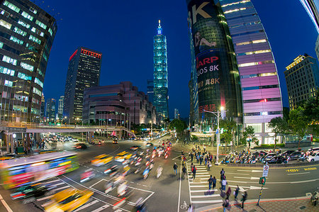 Traffic in front of Taipei 101 at a busy downtown intersection in the Xinyi district, Taipei, Taiwan, Asia Stock Photo - Premium Royalty-Free, Code: 6119-09214301