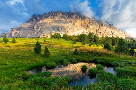 dolomites south - Sasso di Santa Croce reflected in a pond, La Valle (La Val) (Wengen), Badia Valley, South Tyrol, Dolomites, Italy, Europe Stock Photo - Premium Royalty-Free, Code: 6119-09228736