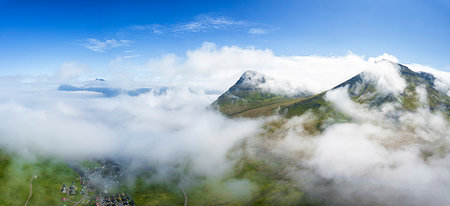 simsearch:6119-09161686,k - Aerial panoramic of clouds above Gjogv, Eysturoy island, Faroe Islands, Denmark, Europe Foto de stock - Sin royalties Premium, Código: 6119-09238653