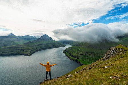 simsearch:6119-09062035,k - Man with open arms rejoices looking to the fjords, Funningur, Eysturoy island, Faroe Islands, Denmark, Europe Stock Photo - Premium Royalty-Free, Code: 6119-09238620