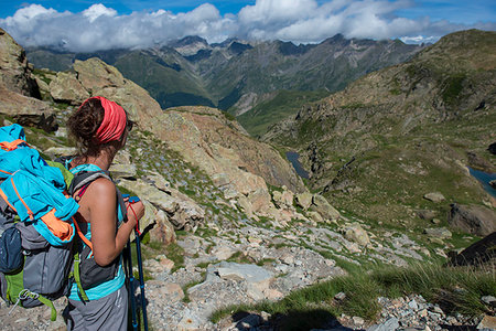 pyrenees atlantique - A hiker looks out at the Pyrenees mountains from the top of Col Peyreget while hiking the GR10 trekking trail, Pyrenees Atlantiques, France, Europe Stock Photo - Premium Royalty-Free, Code: 6119-09238744