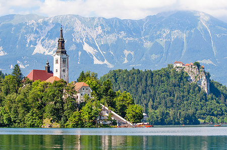 Tiny island with a church, a castle on a crag, and mountain views, Lake Bled, Slovenia, Europe Stock Photo - Premium Royalty-Free, Code: 6119-09238784