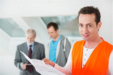 Architect, building owner and construction worker at construction site of new building Stock Photo - Premium Royalty-Free, Code: 6121-07741052