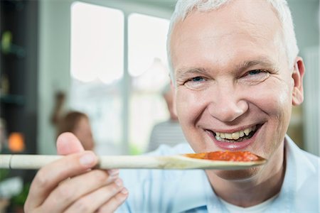 Portrait of mature man tasting food, close up Stockbilder - Premium RF Lizenzfrei, Bildnummer: 6121-07741290