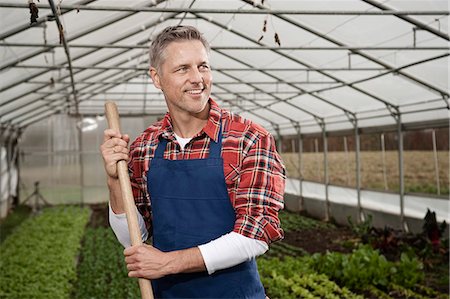 Smiling man in greenhouse Foto de stock - Sin royalties Premium, Código: 6121-07741729