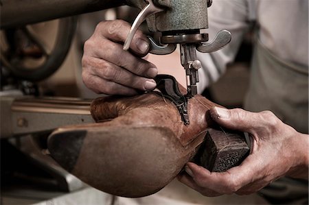 Cobbler working in workshop, close-up Stock Photo - Premium Royalty-Free, Code: 6121-07741913