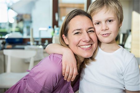 Mother and son embracing Stock Photo - Premium Royalty-Free, Code: 6121-07809829