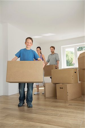 Family father mother son moving new home Stock Photo - Premium Royalty-Free, Code: 6121-07809966
