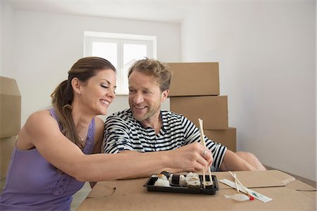 Couple lunch resting eating new apartment Stock Photo - Premium Royalty-Free, Code: 6121-07809978