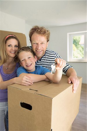 Young family happy new home house keys Stock Photo - Premium Royalty-Free, Code: 6121-07809989