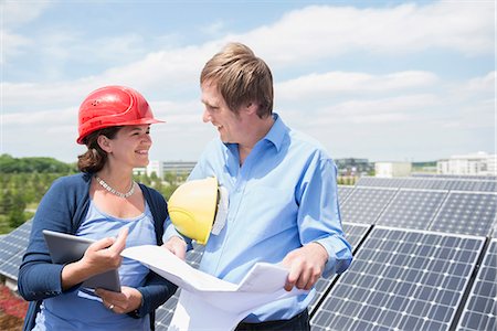 Female architect meeting client solar energy panel Stock Photo - Premium Royalty-Free, Code: 6121-07810062