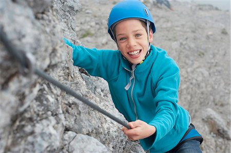 Young teenage boy helmet rope climbing safety Foto de stock - Sin royalties Premium, Código: 6121-07810289