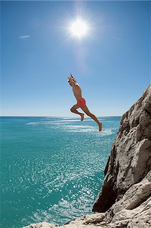 euphorie - Teenager risk danger ocean holiday jump dive water Stockbilder - Premium RF Lizenzfrei, Bildnummer: 6121-07970202