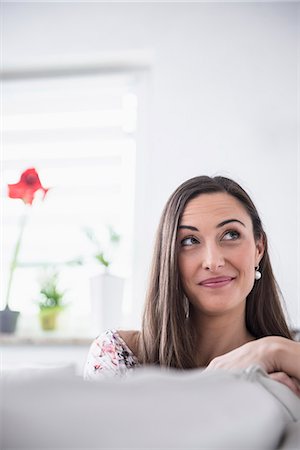 Beautiful woman looking up and day dreaming, Munich, Bavaria, Germany Stockbilder - Premium RF Lizenzfrei, Bildnummer: 6121-07992587