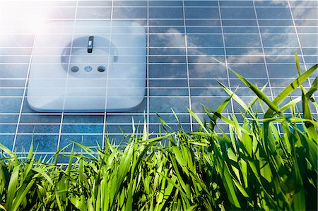 Solar panel with power socket representing environmental conservation, Bavaria, Germany Stock Photo - Premium Royalty-Free, Code: 6121-07992665