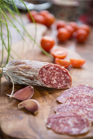 Close up of red sausage with garlic cloves, Germany Stock Photo - Premium Royalty-Free, Code: 6121-08106551