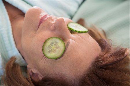 Senior woman with cucumber slices on her eyes, Munich, Bavaria, Germany Stock Photo - Premium Royalty-Free, Code: 6121-08106568