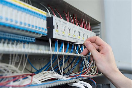 Close-up of electrician installing cable in distribution fusebox, Munich, Bavaria, Germany Stockbilder - Premium RF Lizenzfrei, Bildnummer: 6121-08106775