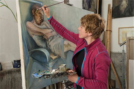 Woman painting at easel, Bavaria, Germany Stock Photo - Premium Royalty-Free, Code: 6121-08106707