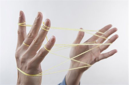 Close-up of a man's hands making a cats cradle with string, Bavaria, Germany Stockbilder - Premium RF Lizenzfrei, Bildnummer: 6121-08106841