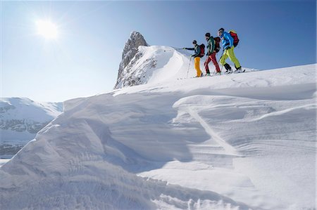 Ski mountaineers climbing on snowy peak, Tyrol, Austria Stock Photo - Premium Royalty-Free, Code: 6121-08106998