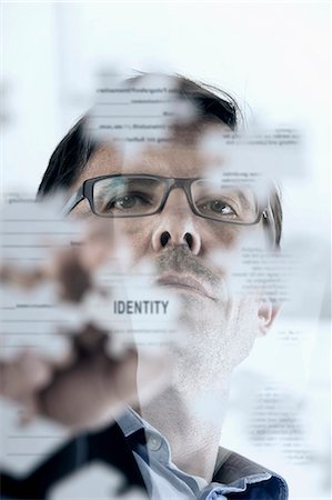 Businessman arranging jigsaw puzzle pieces, Bavaria, Germany Stockbilder - Premium RF Lizenzfrei, Bildnummer: 6121-08228719