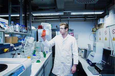 Young male scientist working in a pharmacy laboratory, Freiburg Im Breisgau, Baden-Württemberg, Germany Stock Photo - Premium Royalty-Free, Code: 6121-08522348