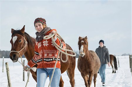 simsearch:6119-08724887,k - Young couple walking with horses in field, Bavaria, Germany Photographie de stock - Premium Libres de Droits, Code: 6121-08660240