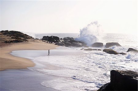 Woman walking on the beach, Western Province, Sri Lanka Stock Photo - Premium Royalty-Free, Code: 6121-08859207