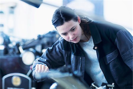 Print worker adjusting printing machine in an industry, Freiburg im Breisgau, Baden-Württemberg, Germany Stock Photo - Premium Royalty-Free, Code: 6121-08859309
