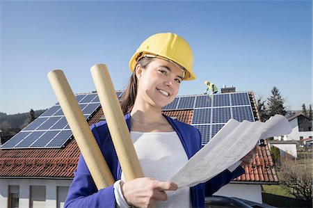 sustainable resource - Female engineer controlling installation of solar panels Stock Photo - Premium Royalty-Free, Code: 6121-08972446