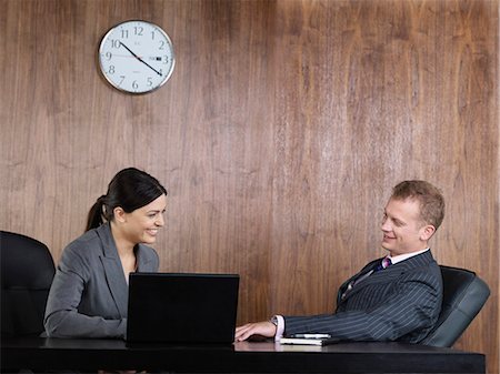 simsearch:614-06718619,k - Business man and woman at desk Stock Photo - Premium Royalty-Free, Code: 6122-07692240