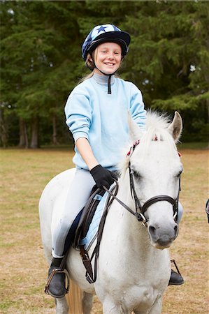 portrait photography with girls and horses - Young girl riding pony Stock Photo - Premium Royalty-Free, Code: 6122-07692695