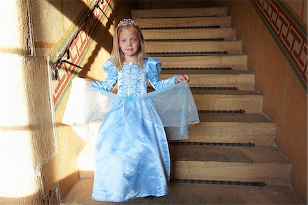 fairytale costumes for girls - Princess climbing down the stairs Stock Photo - Premium Royalty-Free, Code: 6122-07692806