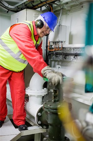 protective workwear - Man doing maintenance works Stock Photo - Premium Royalty-Free, Code: 6122-07693068