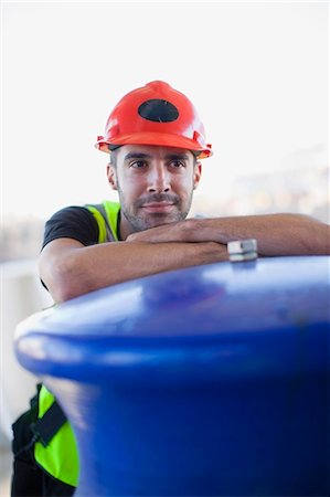 engineer standing with arms crossed - Portrait of a builder Stock Photo - Premium Royalty-Free, Code: 6122-07693081