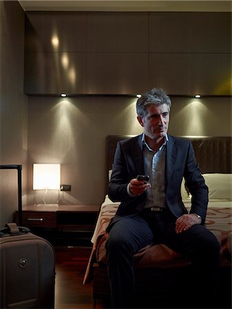 simsearch:6122-07693573,k - Business man in his hotel room Stock Photo - Premium Royalty-Free, Code: 6122-07693530