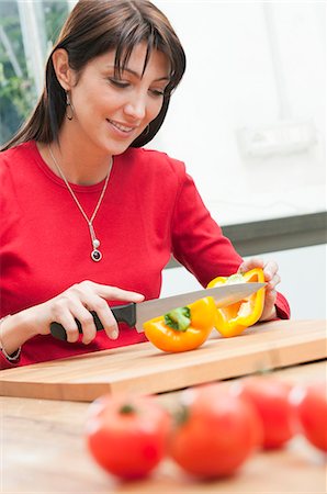simsearch:649-04247665,k - Cutting yellow pepper at kitchen Stock Photo - Premium Royalty-Free, Code: 6122-07693675
