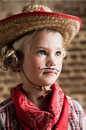 Young girl dressed up as cowgirl Fotografie stock - Premium Royalty-Free, Codice: 6122-07694481