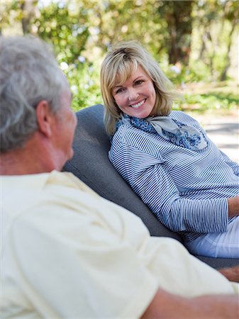 simsearch:6122-07697023,k - Mature couple on loungers in garden Stock Photo - Premium Royalty-Free, Code: 6122-07694630