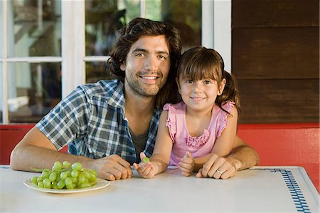 plate outdoor summer table family - Father and daughter looking at camera Stock Photo - Premium Royalty-Free, Code: 6122-07695448