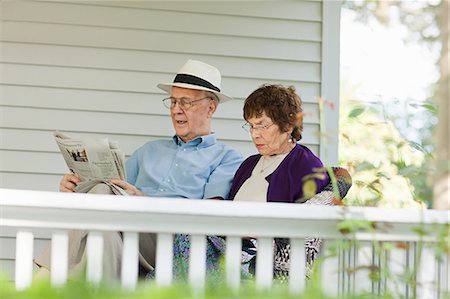 reading newspaper porch - Senior couple reading Stock Photo - Premium Royalty-Free, Code: 6122-07695667