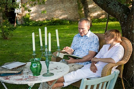 patio furniture - Father and son reading book Stock Photo - Premium Royalty-Free, Code: 6122-07695639