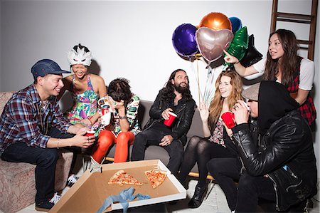 simsearch:6122-07695743,k - Group of people sitting at party Stock Photo - Premium Royalty-Free, Code: 6122-07695741