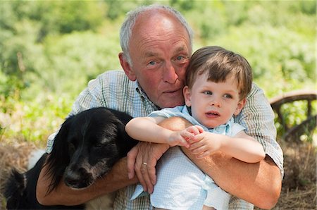 senior with dogs - Grandfather and grandson with dog, portrait Stock Photo - Premium Royalty-Free, Code: 6122-07696701