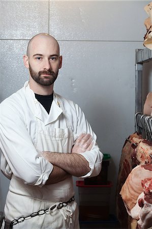 Butcher in meat storage area Foto de stock - Sin royalties Premium, Código: 6122-07696806